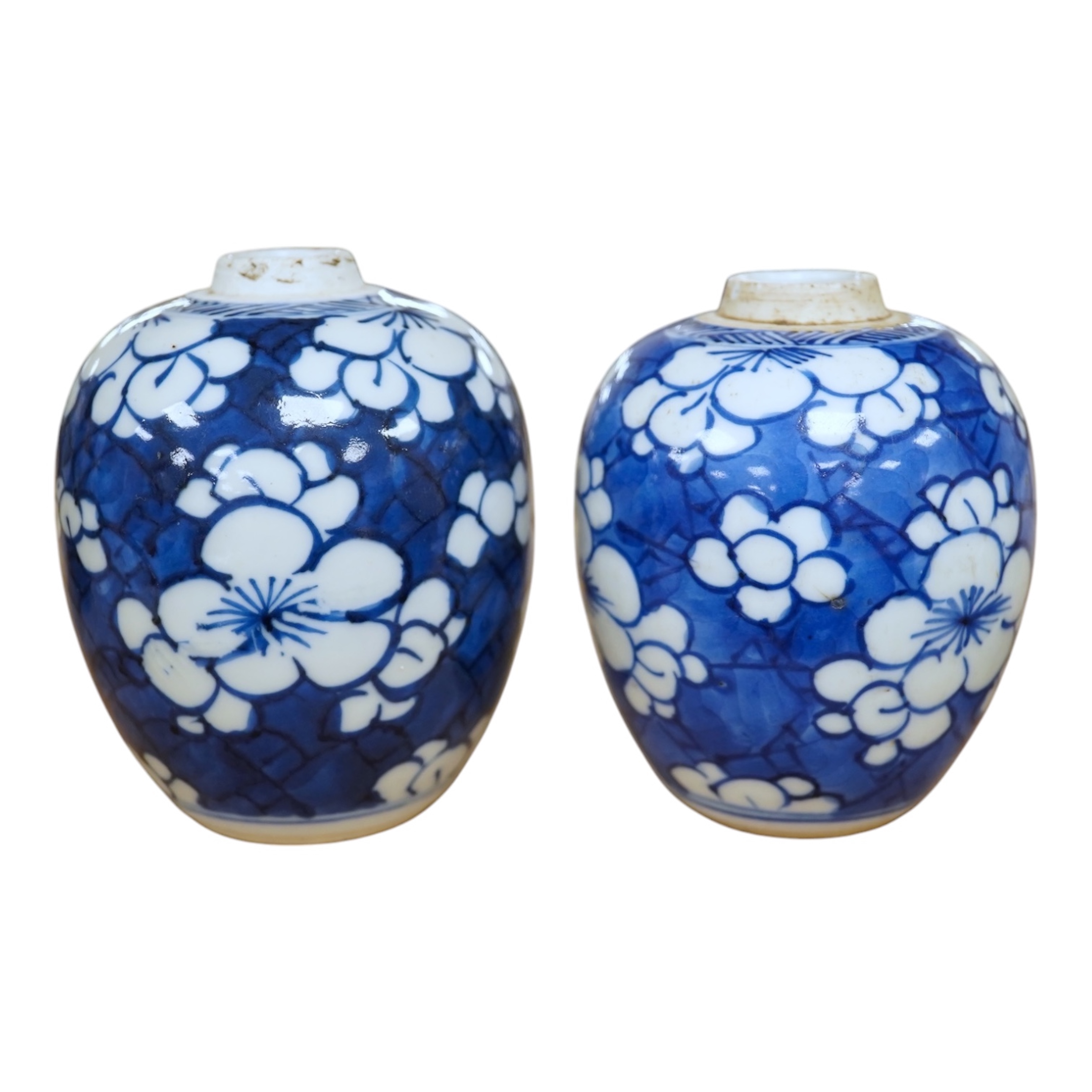 Two small Chinese blue and white prunus jars, Kangxi period, tallest 9.5cm. Condition - good